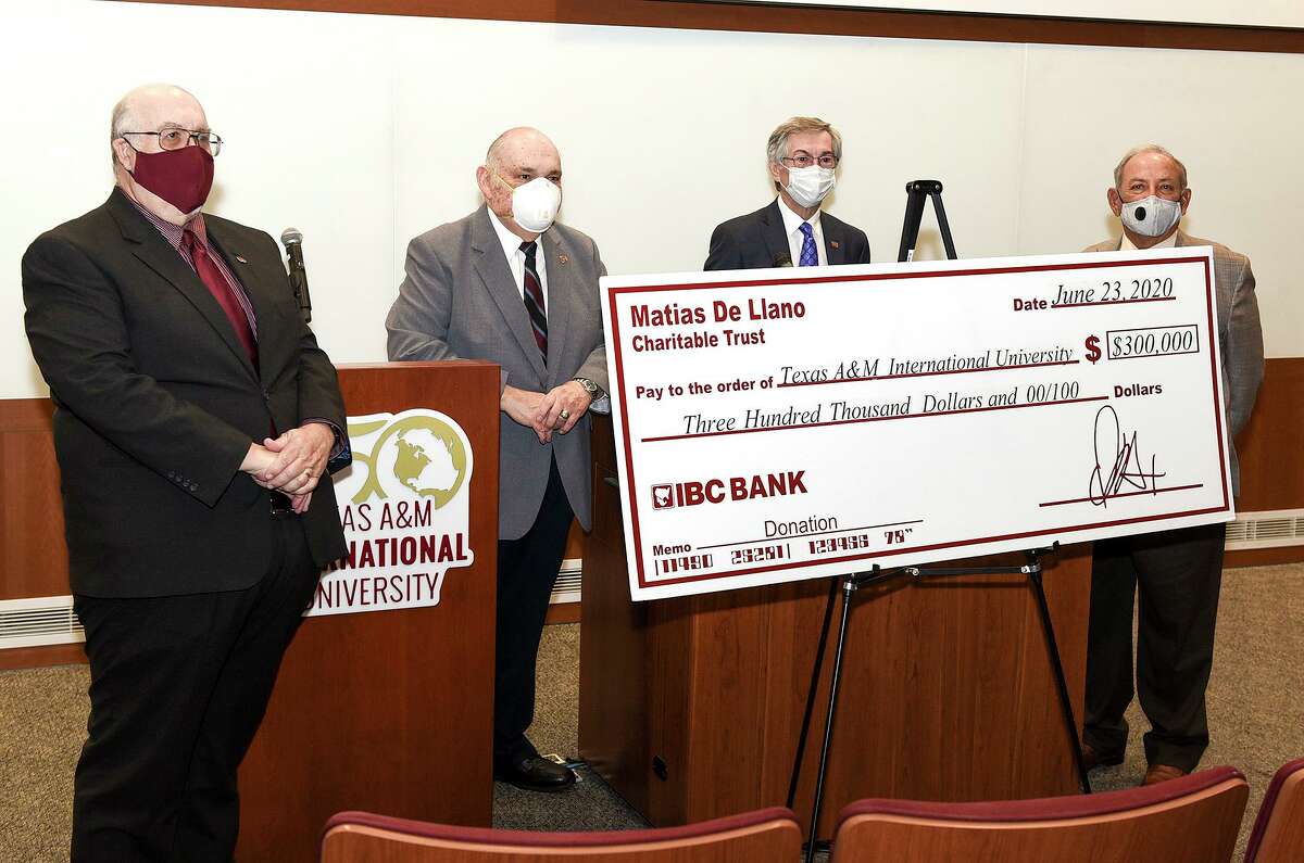 TAMIU president Dr. Pablo Arenaz and IBC Bank Trust Committee representatives Larry Norton, Doug Howland and Rudolph Miles gather for a photo as the Matias De Llano Trust donated $300,000 to TAMIU on Tuesday, June 23 at the TAMIU Academic Innovation Center Auditorium.