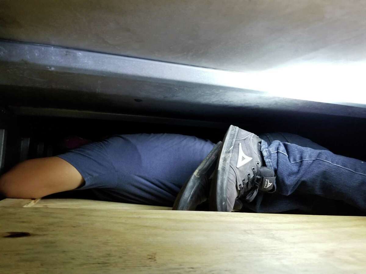 An immigrant who was in the country illegally can be seen inside the hidden compartment of a box truck. Overall, U.S. Border Patrol agents said they detained 11 immigrants.