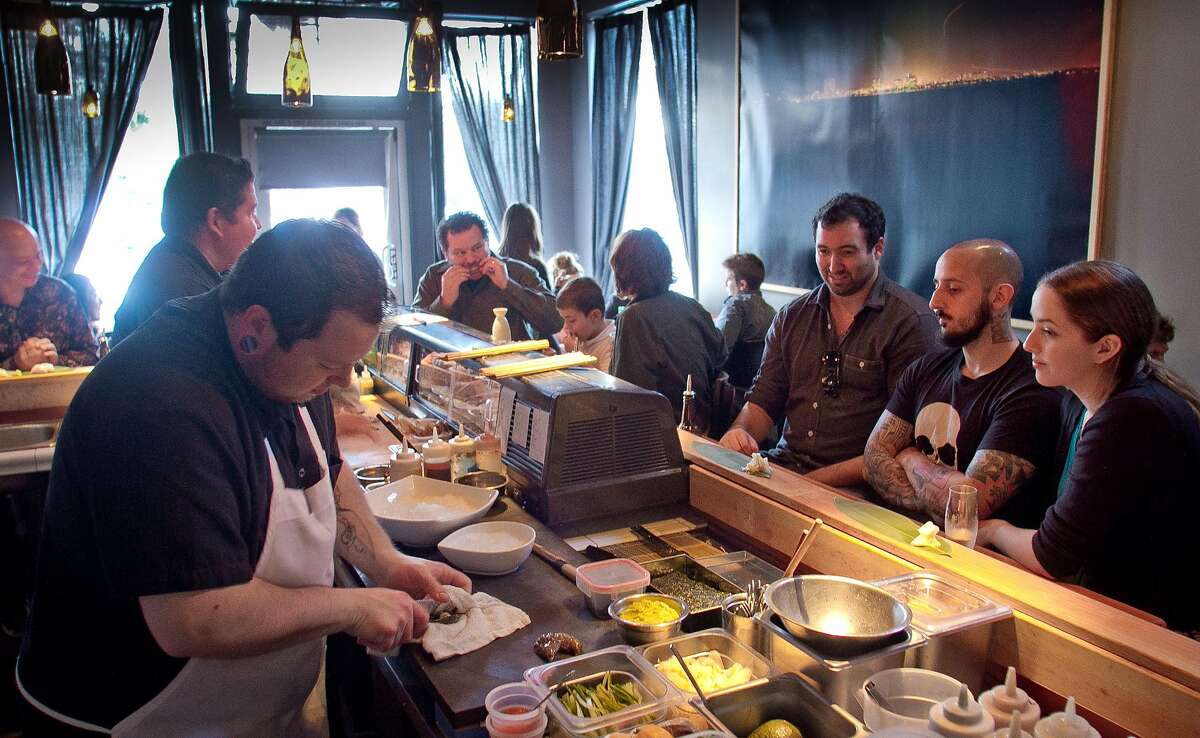 Diners watch cook Jake Whitlock make sushi at Ichi Sushi in San Francisco, Calif., on September 16th, 2011.