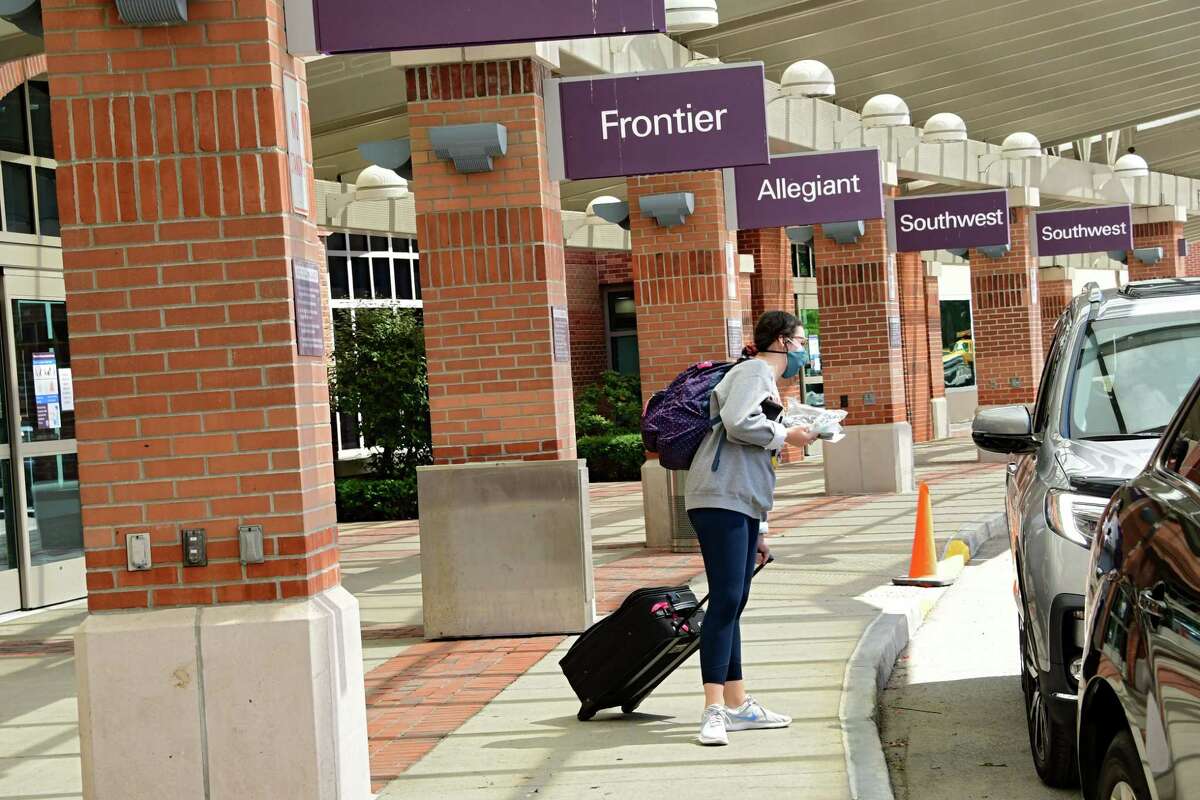 A woman looks for her ride at Albany International Airport on Wednesday, June 24, 2020 in Colonie, N.Y. Governor Andrew Cuomo has directed that all travelers arriving in New York State from states heavily impacted by the spread of the Coronavirus are subject to a 14-day quarantine. (Lori Van Buren/Times Union)