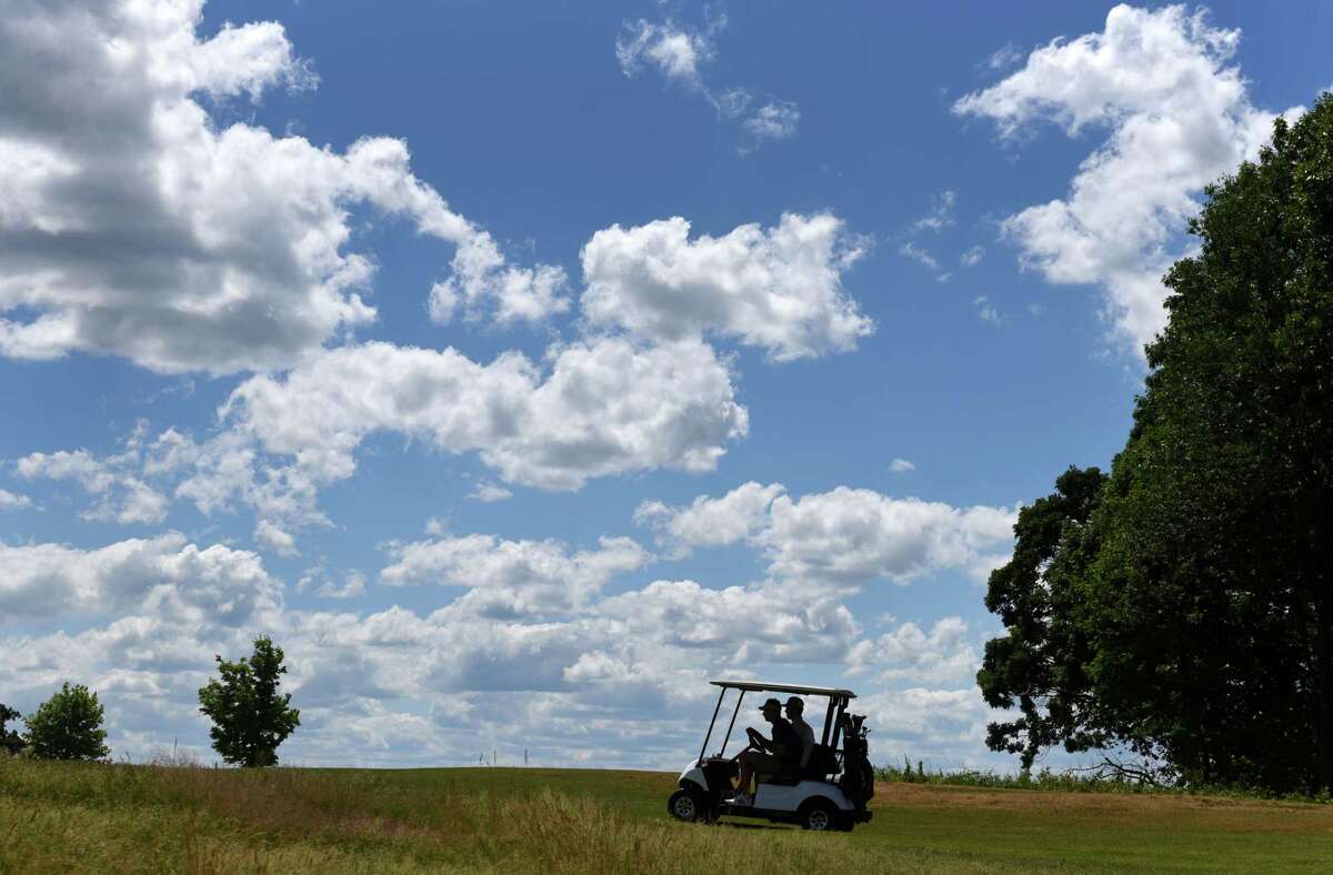 Golfers play under a dappled sky on Wednesday, June 24, 2020, at Frear Park Municipal Golf Course in Troy, N.Y. (Will Waldron/Times Union)