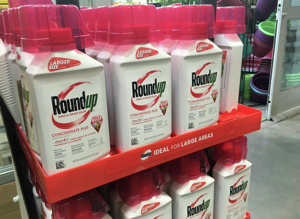 FILE - In this, Feb. 24, 2019, file photo, containers of Roundup are displayed at a store in San Francisco. German pharmaceutical company Bayer announced Wednesday, June 24, 2020, itas paying up to $10.9 billion to settle a lawsuit over subsidiary Monsantoas weedkiller Roundup, which has faced numerous lawsuits over claims it causes cancer. (AP Photo/Haven Daley, File)
