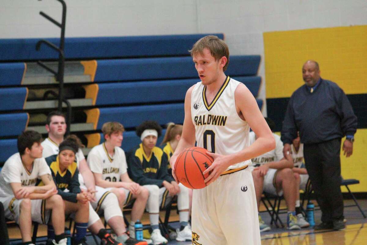 Ryan Kolenbrander (0) was a standout in many sports including basketball. (Star file photo)
