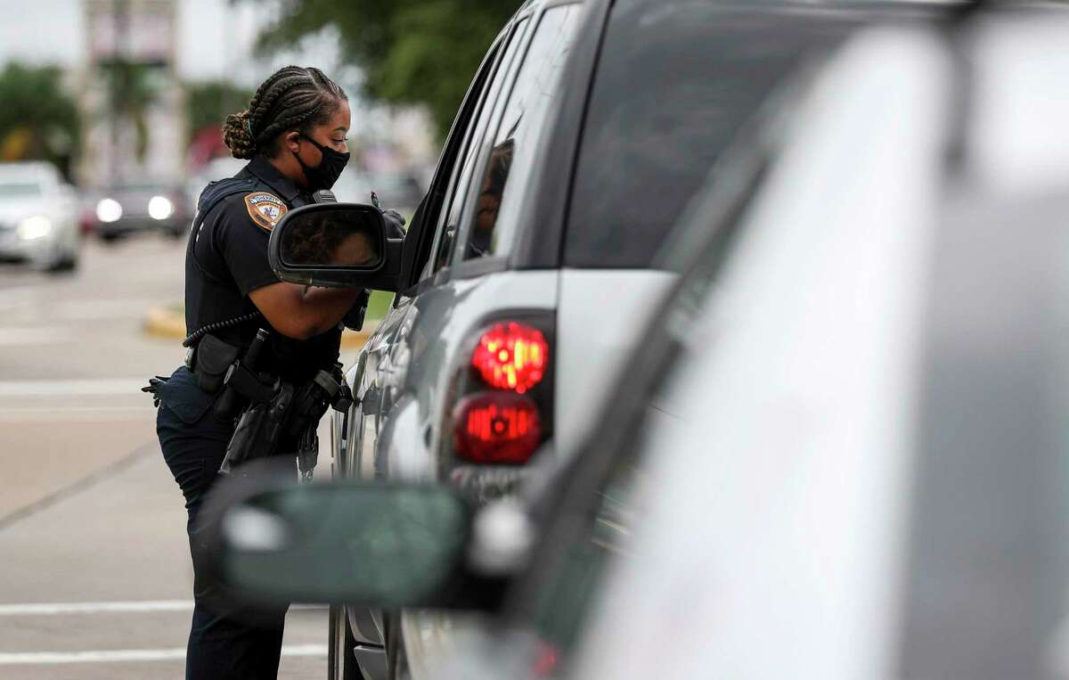 Harris County Sheriff's Deputy Nakeitha Dussette conducts a traffic stop Wednesday, June 24, 2020, at the intersection of Bellaire Boulevard and Metro Boulevard in Houston.