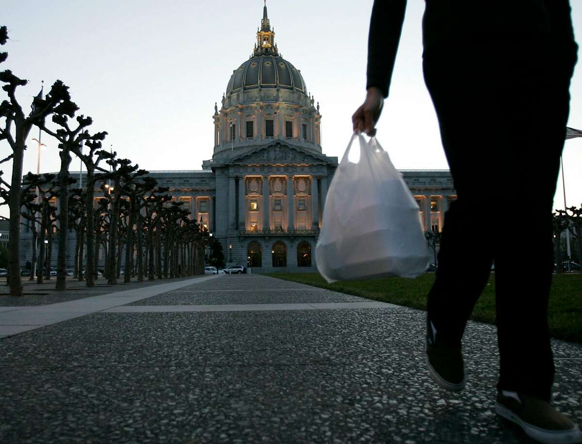 San Francisco City Hall is in the background where earlier today, March 27, 2007, the San Francisco Board of Supervisors voted to ban plastic bags at groceries and pharmacies, making SF the first city in the nation to pass such a ban. Photo by Michael Maloney / San Francisco Chronicle
