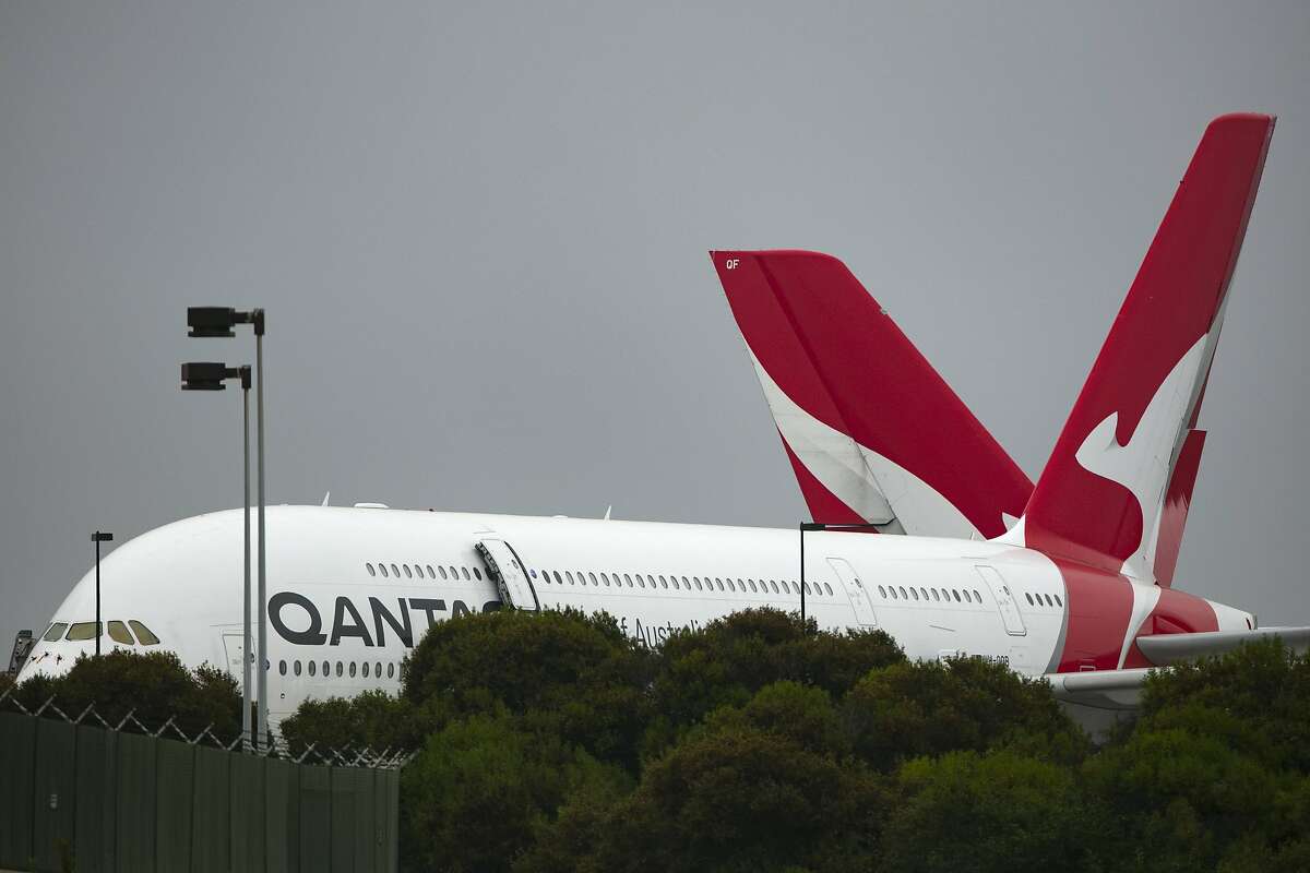 Two Qantas planes sit outside its hangar at Los Angeles International Airport in Los Angeles on Thursday, June 25, 2020.