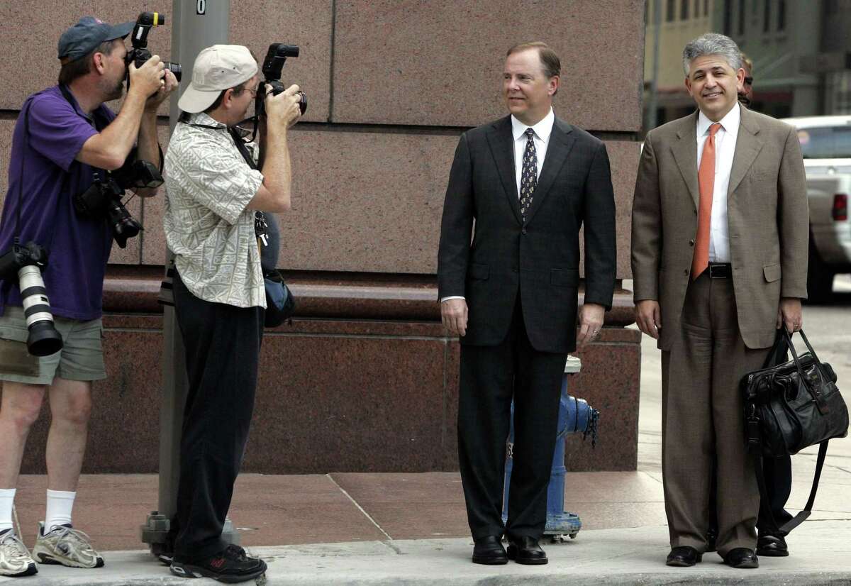 Former Enron executive Jeffrey Skilling, center, and his attorney Daniel Petrocelli, right, head to court in 2006 in Houston. Recently out of prison, Skilling is pitching a new venture incorporated by his wife.