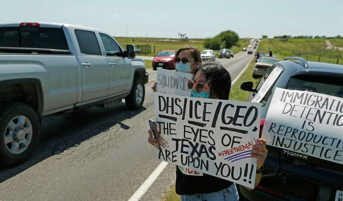 Laura Molinar pulls off to the side as other advocacy group car protest by driving past at Karnes County Residential Center 409 FM1144, Karnes City, Texas, 78118. Advocacy groups are protesting family detention amid the pandemic, as coronavirus spreads rapidly through detention facilities across the country on Saturday, May 16, 2020.