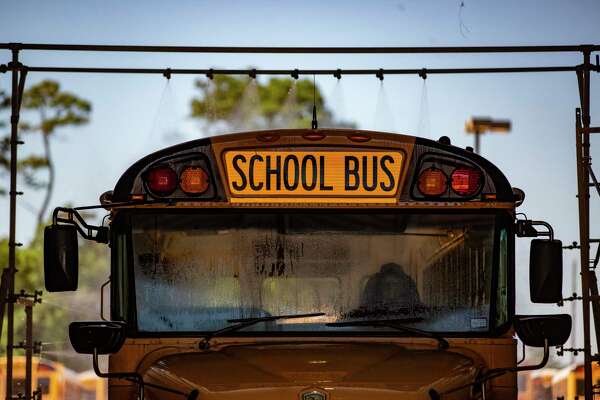 An Humble ISD school bus gets a wash on Thursday, June 11, 2020, in Humble in preparation for the new school year.