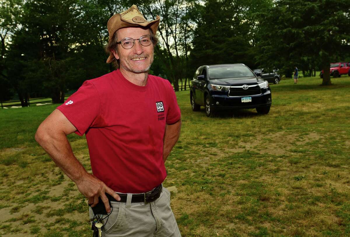 Program Director Kevin Meehan says goodbye to friends at Ambler Farm during a Goodbye Parade on June 25. Meehan is leaving the farm after 13 years.