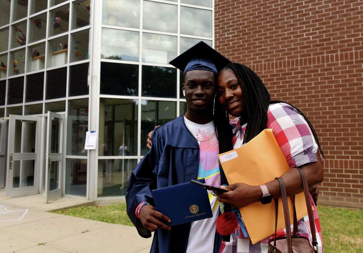 Graduating Schenectady High School senior Malakai Myles is pictured with his mother, Fatimah Christmas, following commencement on Friday, June 26, 2020, in Schenectady, N.Y. (Will Waldron/Times Union)
