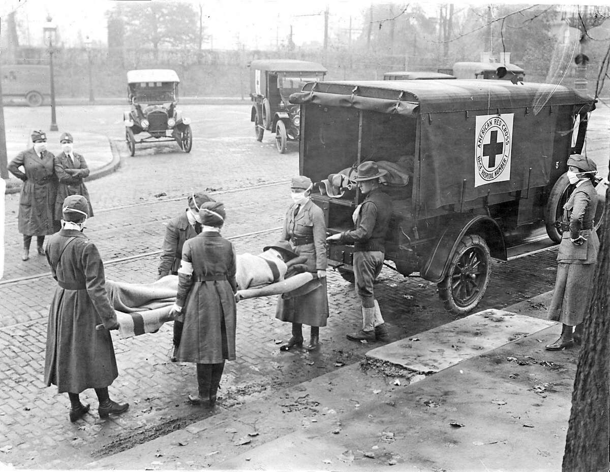Members of the American Red Cross remove Spanish Flu victims in St. Louis. In San Antonio, 53 percent of the population became sick as local officials struggled to accept the truth of the disease.