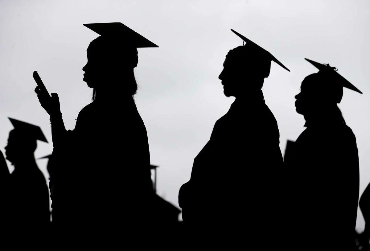 FILE - In this Thursday, May 17, 2018 file photo, new graduates line up before the start of a community college commencement in East Rutherford, N.J. Scholarship search websites promise students access to millions of awards totaling billions in free money for college. But once you provide your email address, scholarship listings arenat the only things youall receive. a[You] are going to get a lot of spam,a says Monica Matthews, creator of the website how2winscholarships.com. aYou are going to be inundated.a (AP Photo/Seth Wenig)