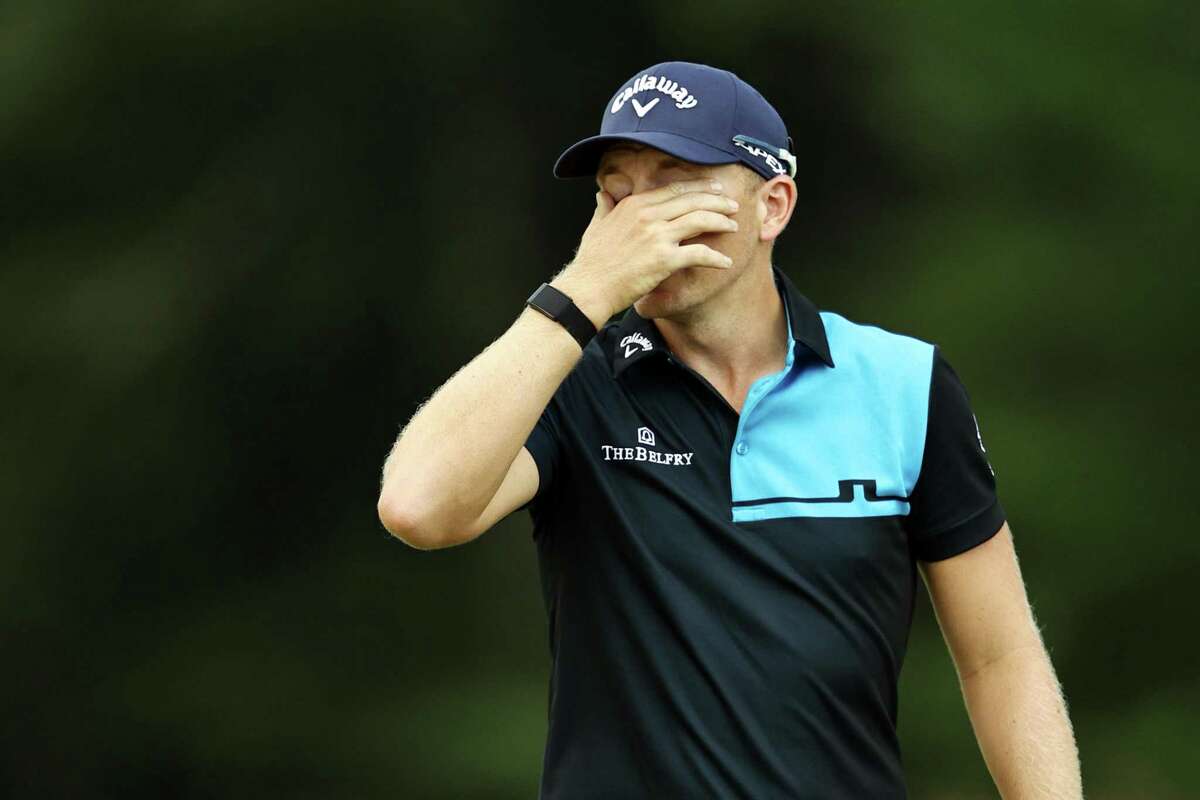 Matt Wallace reacts on the fourth green during Friday’s second round of the Travelers Championship. Wallace is playing alone after the other two members of his group, Denny McCarthy and Bud Cauley, withdrew from the tournament on Friday following McCarthy’s positive COVID-19 test.