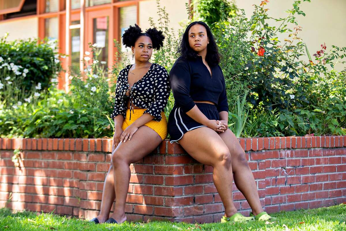 From left: A portrait of Tamia Proctor and Isabella Lawrence outside the Lakeview branch of the public library on Thursday, June 25, 2020, in Oakland, Calif. They are former employees at Boba Guys. They said they faced racism from customers and no support from managers when they reported problems.