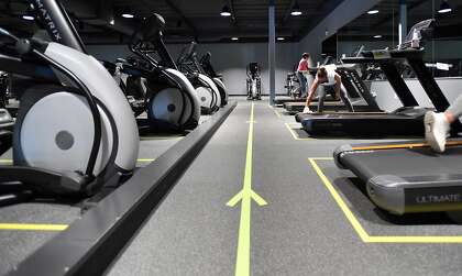 Directional tape marks where to walk at Sonoma Fitness in Petaluma.
