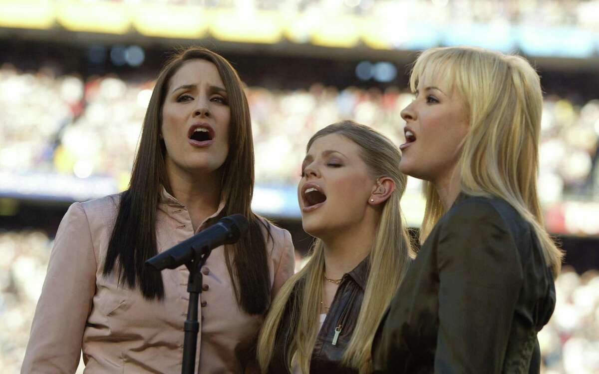 The Dixie Chicks perform the national anthem at Super Bowl XXXVII in 2003. The trio is now simply known as The Chicks.