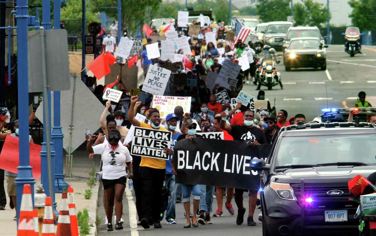 Several hundred Black Lives Matter protesters hold a Unity in the Community march along Stratford Ave over to the Margaret Morton Government Center on Broad Street in downtown Bridgeport, Conn., on Saturday, June 27, 2020. Hundreds gathered at Baker-Isaac Funeral home on Stratford Ave on the East Side to stage before marching to downtown. At the center Mayor Joe Ganim, Councilman Mary McBride-Lee, Rev. Herron Gaston and others spoke, including Rev. Dr. W. Franklyn Richardson from the National Action Network. Rev. Richardson spoke in place of Rev. Al Sharpton who was unable to attend.