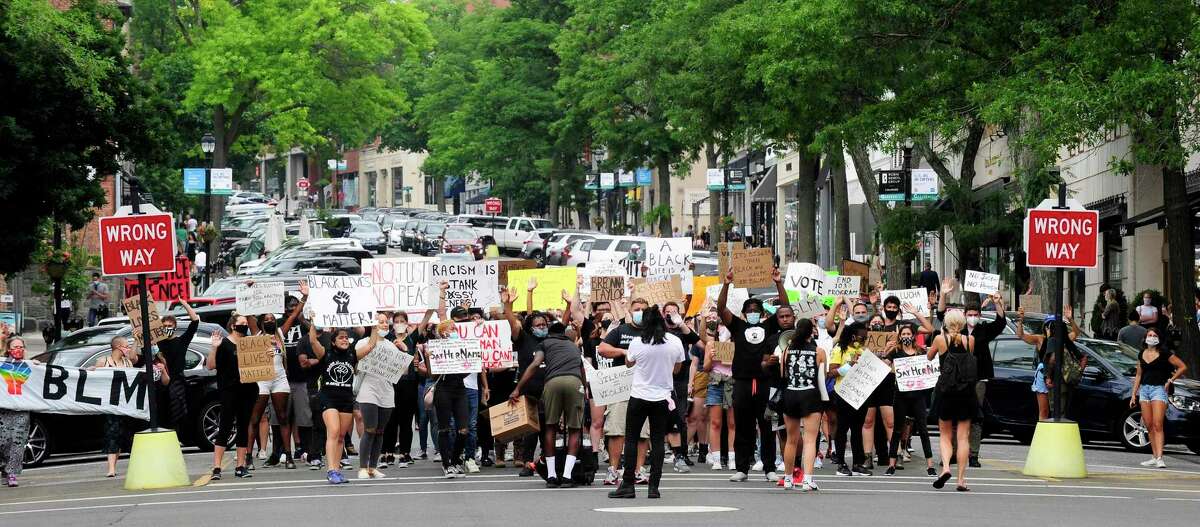 A couple hundred protesters join with organizers of Justice for Brunch on Saturday, June 27, 2020 as they march from Greenwich Town Hall down Greenwich Avenue to a rally at the Island Beach Lot where speakers called for change and reform, highlighting recent national events and localizing racism they say is present in Greenwich, Connecticut.