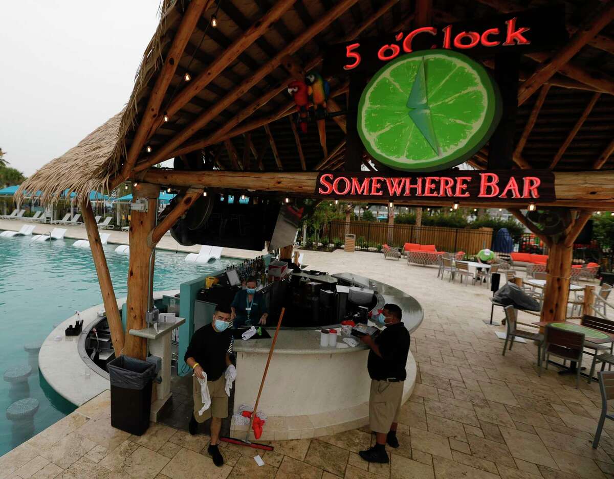 Employees prepare the bar area of the ‘5 O’Clock Somewhere’ swim-up pool bar during the grand opening of the Margaritaville Resort, Friday, June 26, 2020, in Montgomery. The highly anticipated 186-acre resort features a splash of dining concepts and recreational activities, including a water park, an 18-hole golf course and boat rentals. In addition to a 72,000 square foot conference and event space, there are 303 suites in the 20-story luxury tower and another 32 lake cottages on the property.