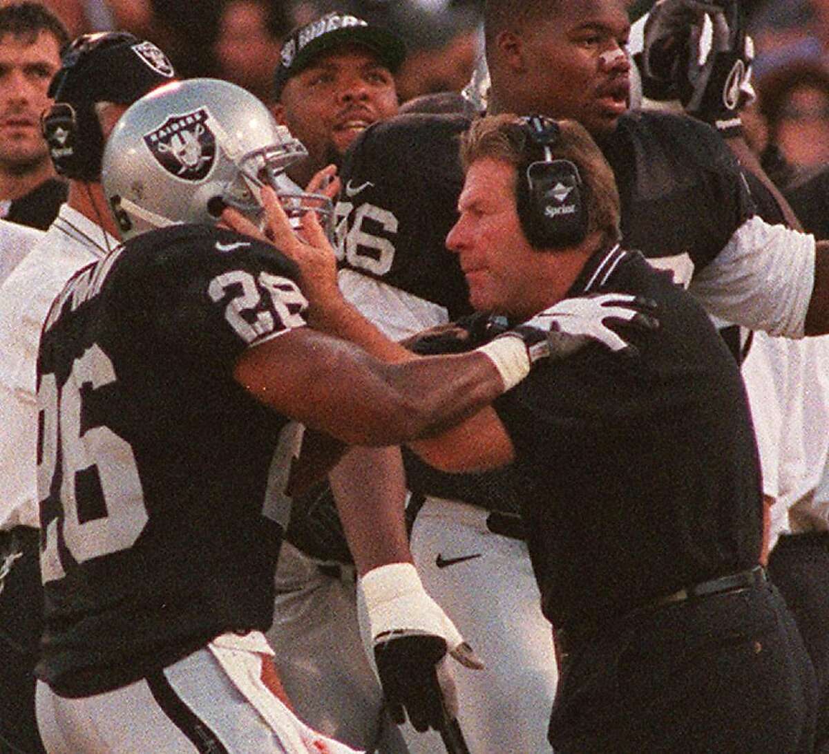 RAIDERS BUGEL/08SEP97/SP/FRL: Joe Bugel congratulated Napoleon Kaugman on the sidelines after his TD. Chronicle photo by Frederic Larson