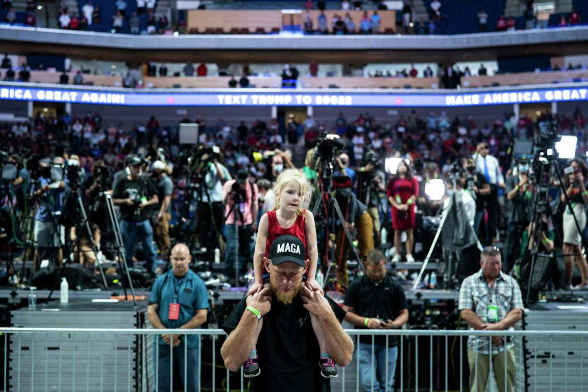 Rally attendees wait for President Donald Trump to arrive at the BOK Center in Tulsa, Okla., on June 20, 2020.