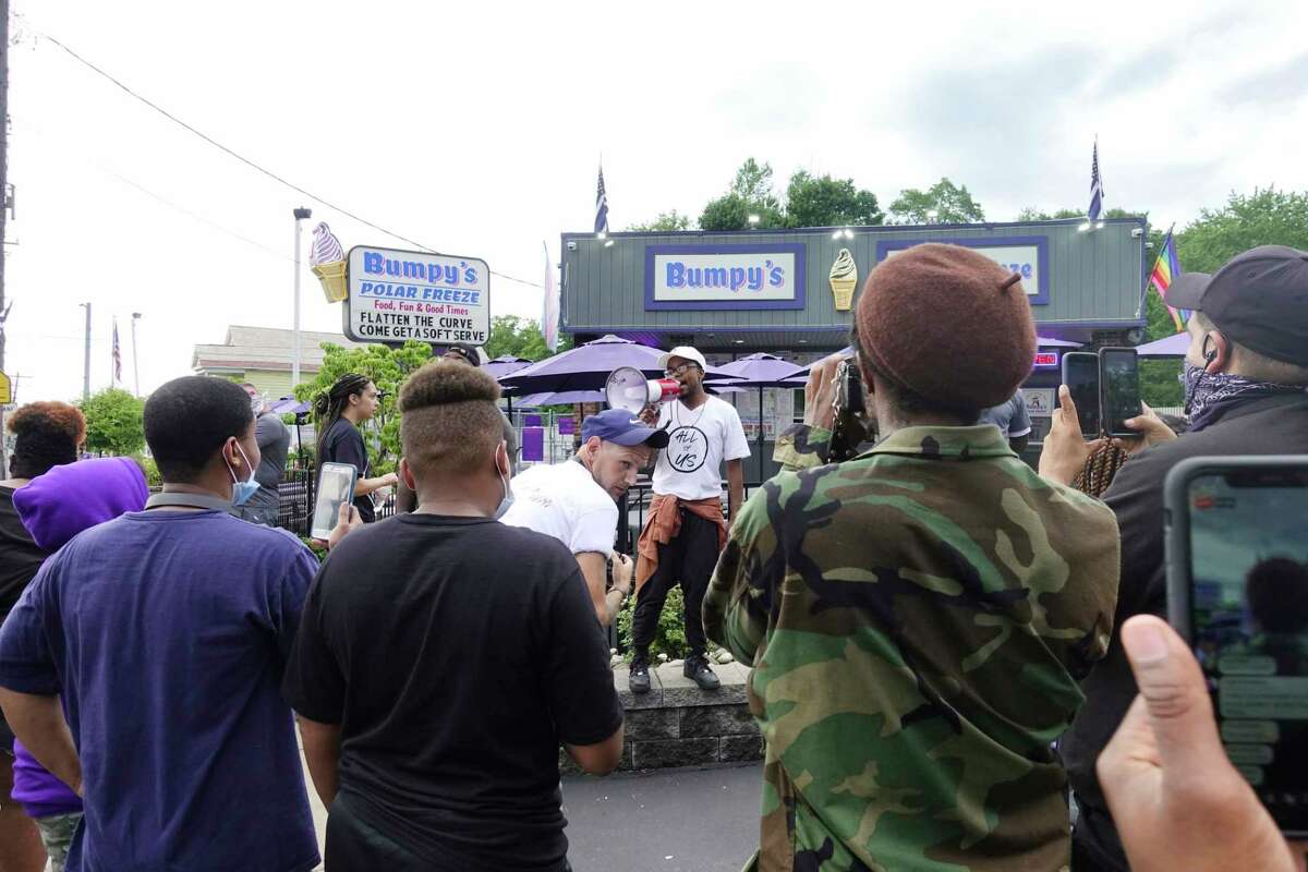 Demonstrators gather at Bumpy's Polar Freeze for a protest on Sunday, June 28, 2020, in Schenectady, N.Y. The protest at the business was organized after the owner's racist texts were made public. (Paul Buckowski/Times Union)