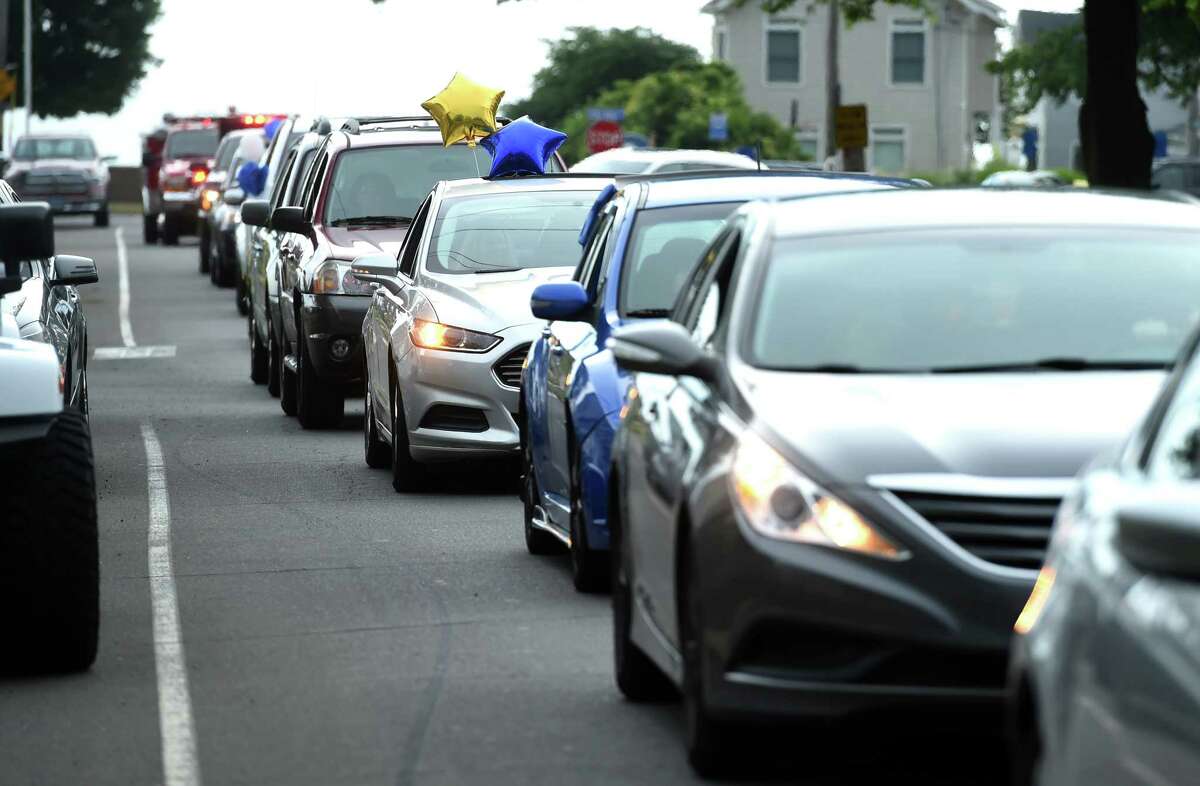 A motorcade for East Haven High School grads begins on Coe Avenue with a final destination of East Haven High School on June 28, 2020.
