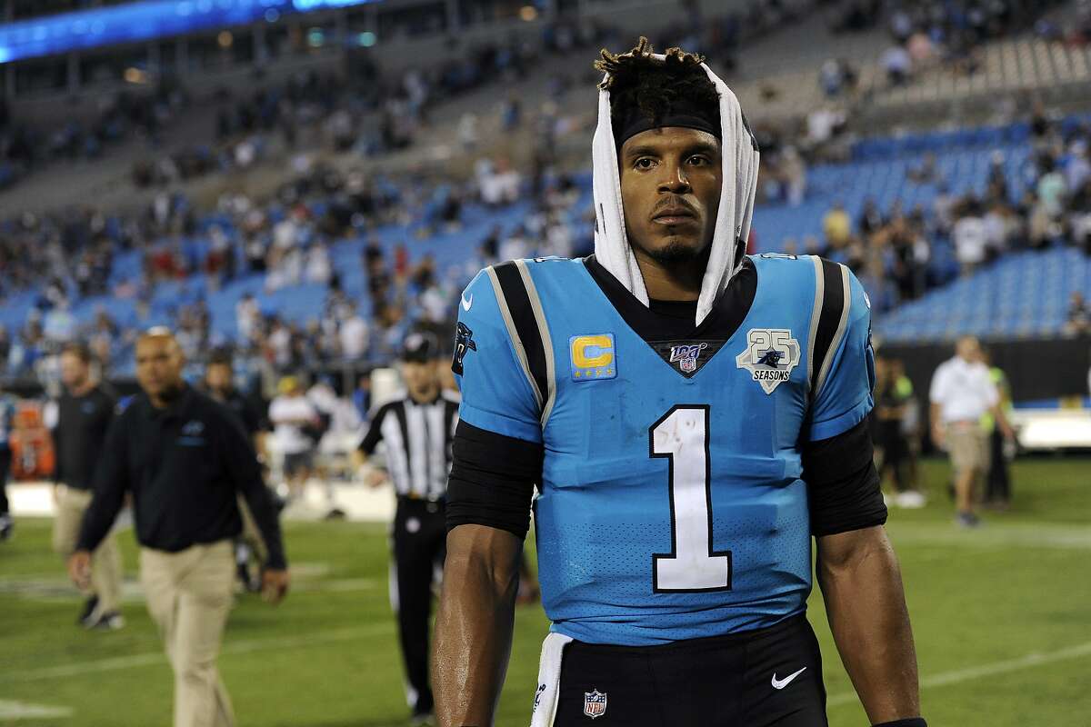 FILE - In this Sept. 13, 2019, file photo, Carolina Panthers quarterback Cam Newton (1) walks off the field following the Panthers 20-14 loss to the Tampa Bay Buccaneers in an NFL football game in Charlotte, N.C. (AP Photo/Mike McCarn, File)