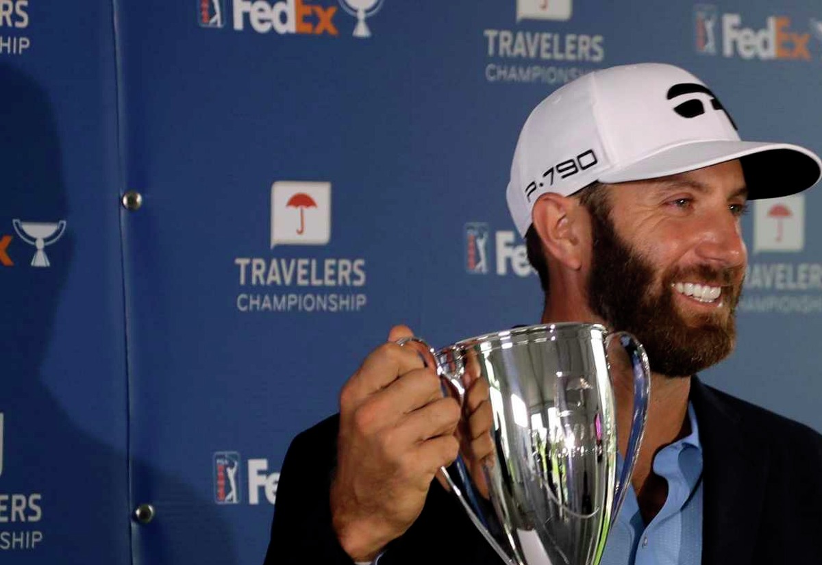 Dustin Johnson poses with the trophy after winning the Travelers Championship in 2020 in Cromwell.