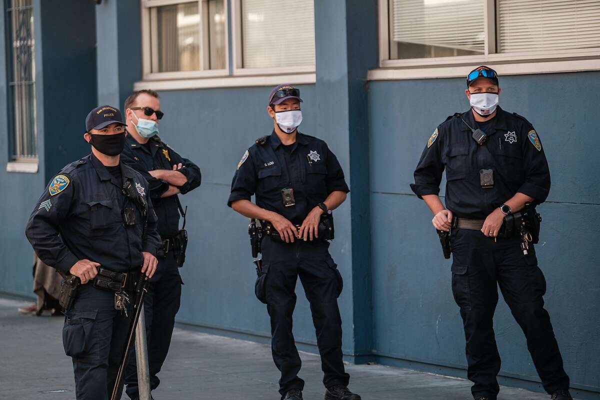 Police officers monitoring protesters in San Francisco on Friday, May 22, 2020.