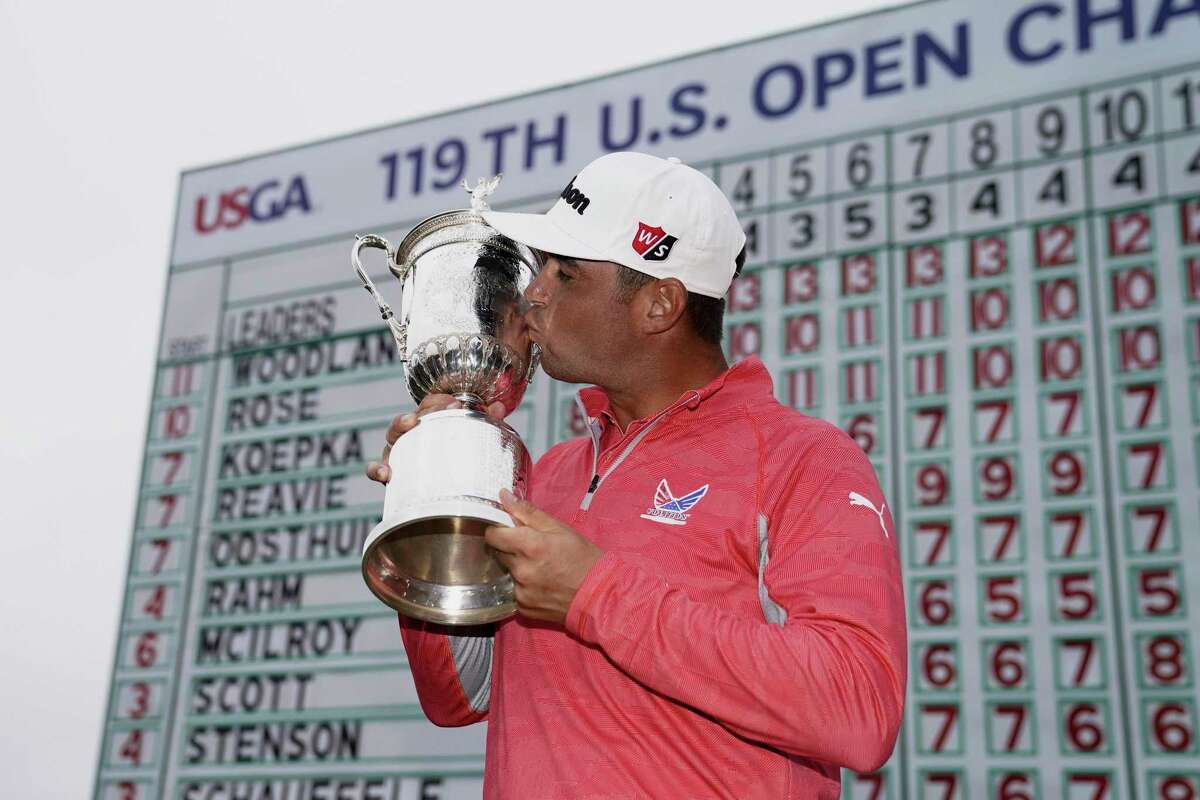 FILE - In this June 16, 2019, file photo, Gary Woodland poses with the trophy after winning the U.S. Open golf tournament in Pebble Beach, Calif. The U.S. Open is returning to NBC starting with this year’s tournament.