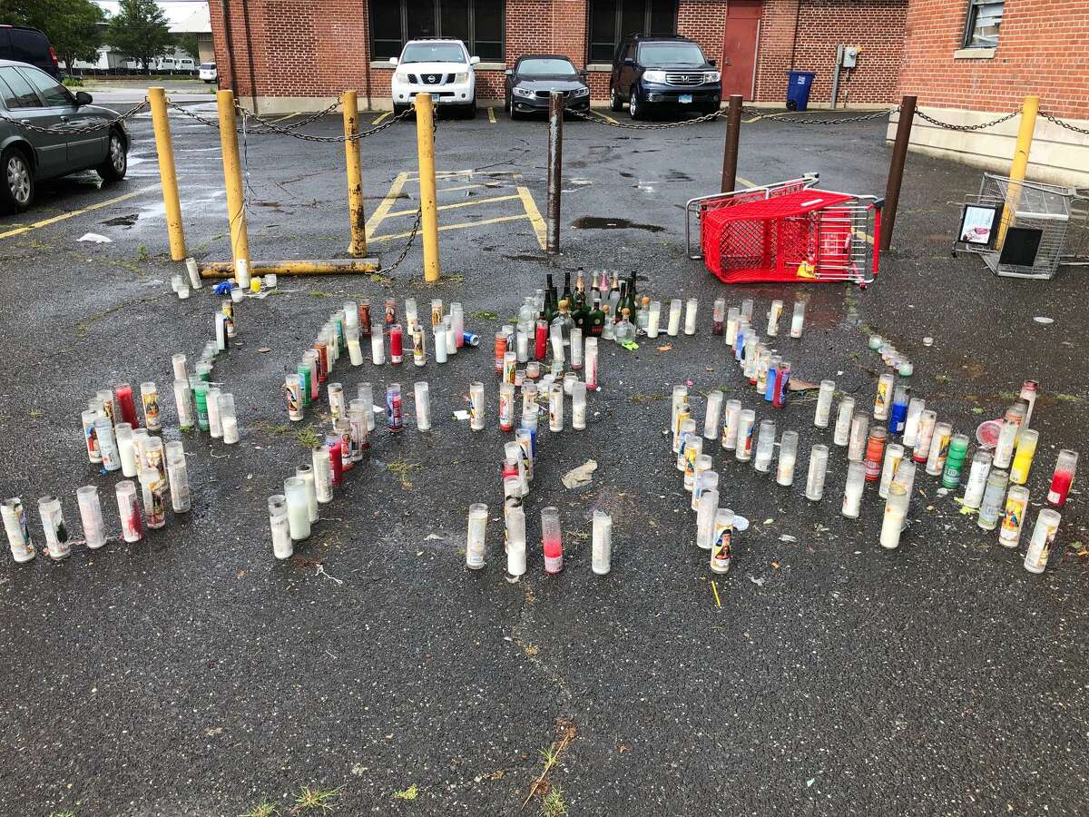 Candles have been placed at the spot where Eugene “Stink” Stinson was believed to have been shot, on Anthony Street in the P.T. Barnum housing project. On Sunday, June 28, police said Treyvon Rabb, 19, or Derby, shot at mourners gathered at the memorial
