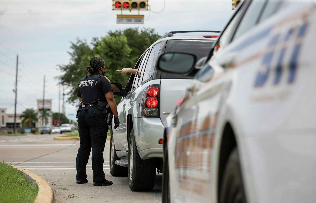 Harris County Sheriff's Deputy Nakeitha Dussette conducts a traffic stop Wednesday, June 24, 2020, near the intersection of Bellaire Boulevard and Metro Boulevard in Houston.
