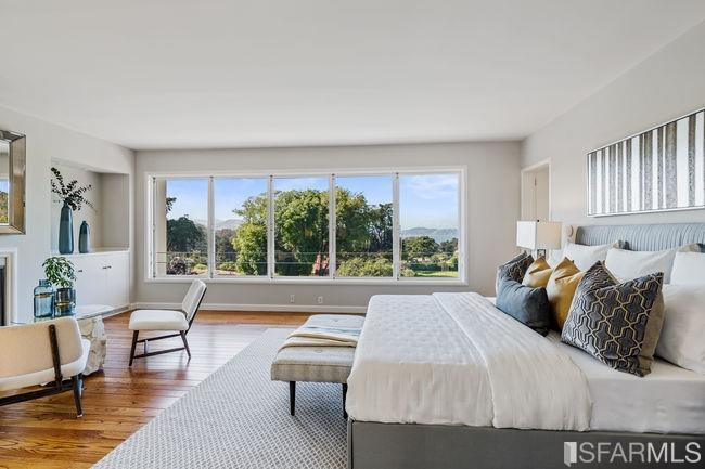 Upstairs, the master bedroom looks out over the Presidio all the way to the bay.