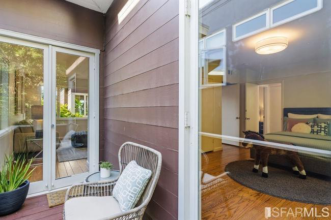 This bedroom and the sitting area can both access a private deck.