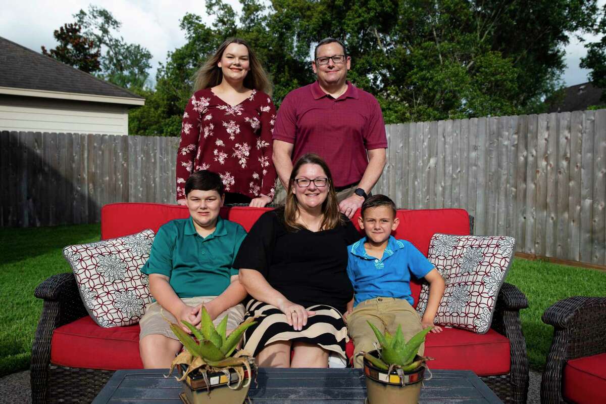 Emily McKay, clockwise, 17, Tim McKay, 52, Owen McKay, 7, pediatrician Dr. Sandy McKay, 42, and Jacob McKay, 12, pose for a photograph in their backyard Monday, June 29, 2020, in Missouri City. Owen has a 15-minute video chat session with McGovern Medical School student Caroline Andrews, who offered to tutor him through, every day. A group of med students offered to tutor children of front line physicians online during COVID.