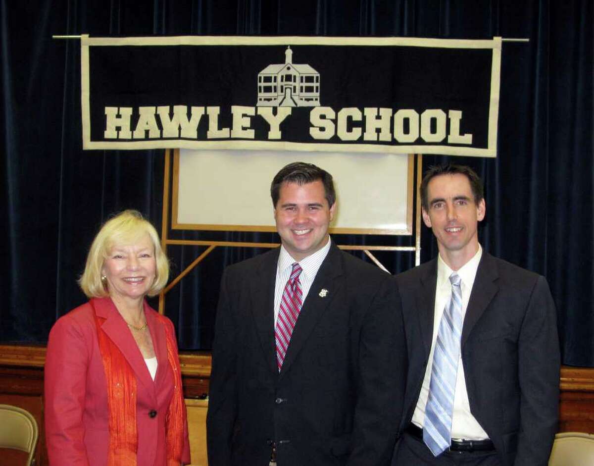 State Rep. Christopher Lyddy, D-Newtown (center) received a “Tip of the Cap” from Alex Johnston (right), the founder and CEO of Connecticut Coalition for Achievement Now, for leading education reform in the House and speaking out on lowering the achievement gap across the state. Newtown Superintendent Janet Robinson (left) praised Lyddy for representing Newtown positively and being available to his constituency at all hours.