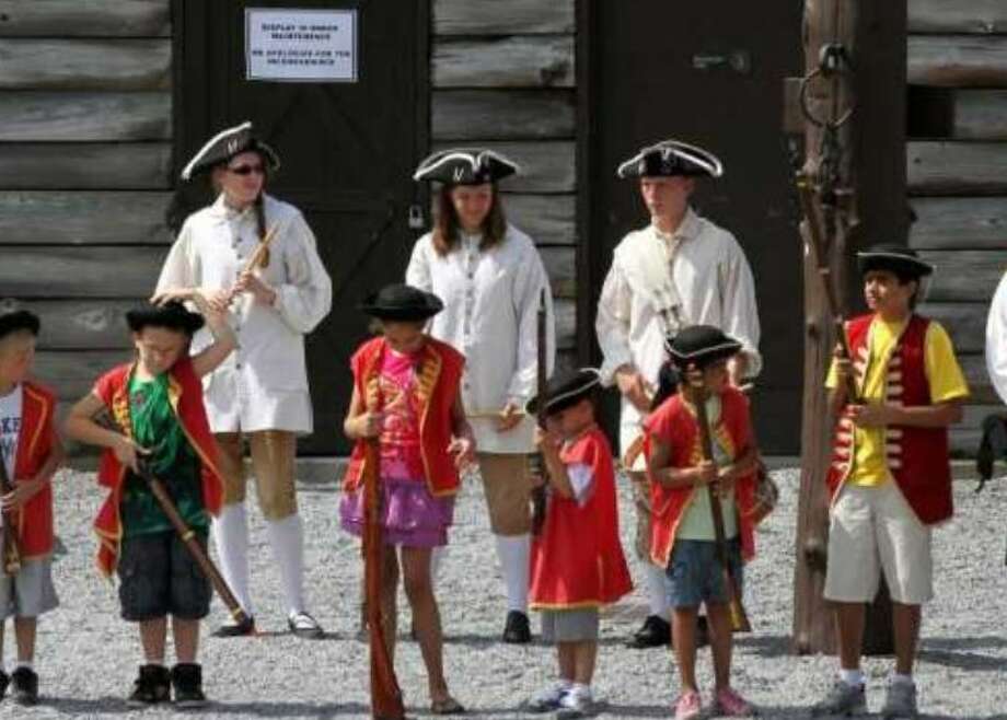 In this file photo dated July 28, 2011, children line up for a walk during a visit to Fort William Henry in Lake George, New York. Photo: File photo by Times Union