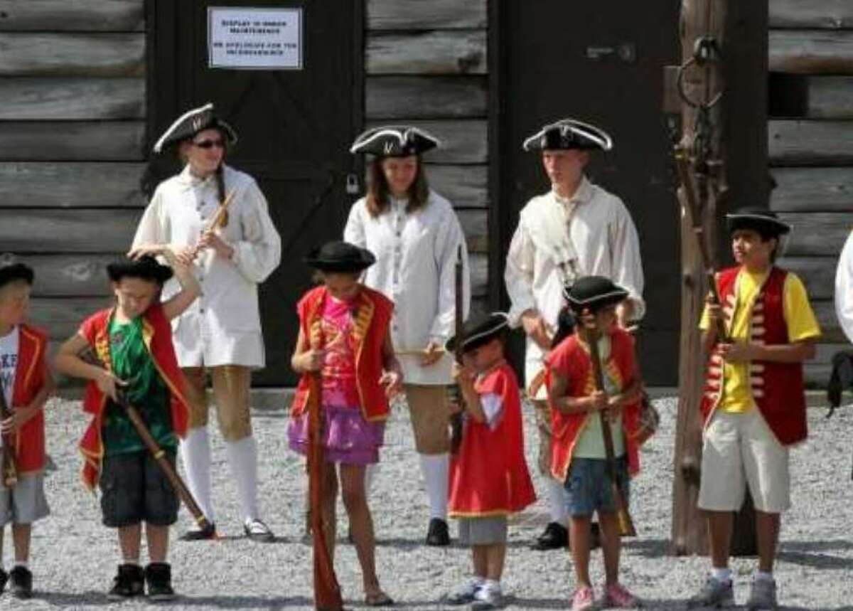 In this July 28, 2011 file photo, children line up to march during a tour at Fort William Henry in Lake George, N.Y.