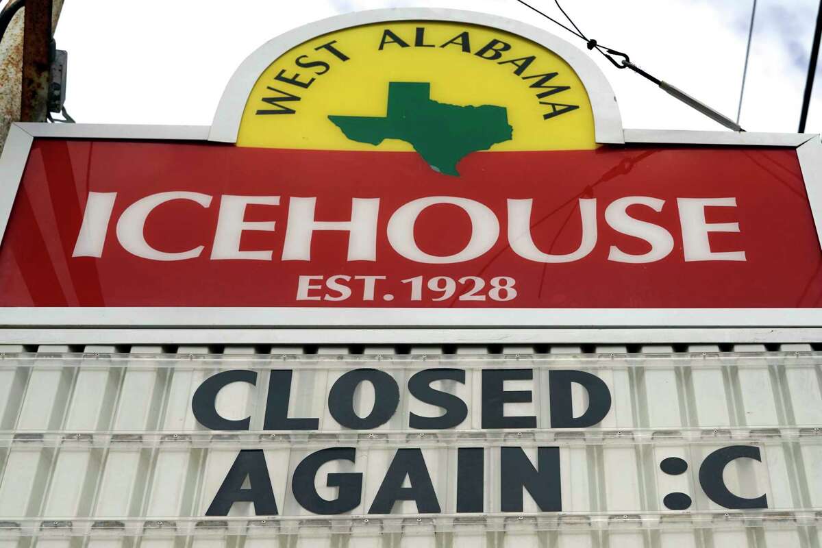A sign outside the West Alabama Icehouse shows the bar is closed Monday, June 29, 2020, in Houston. (AP Photo/David J. Phillip)
