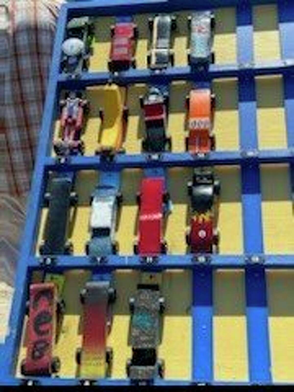 Scouts from BSA Troop 74 in Reed City entered their handmade cars in the annual Pinewood Derby race June 28 at the Scout House. Contestants were awarded trophies for first through third place finishes and Best in Show for each age category. (Submitted photo)