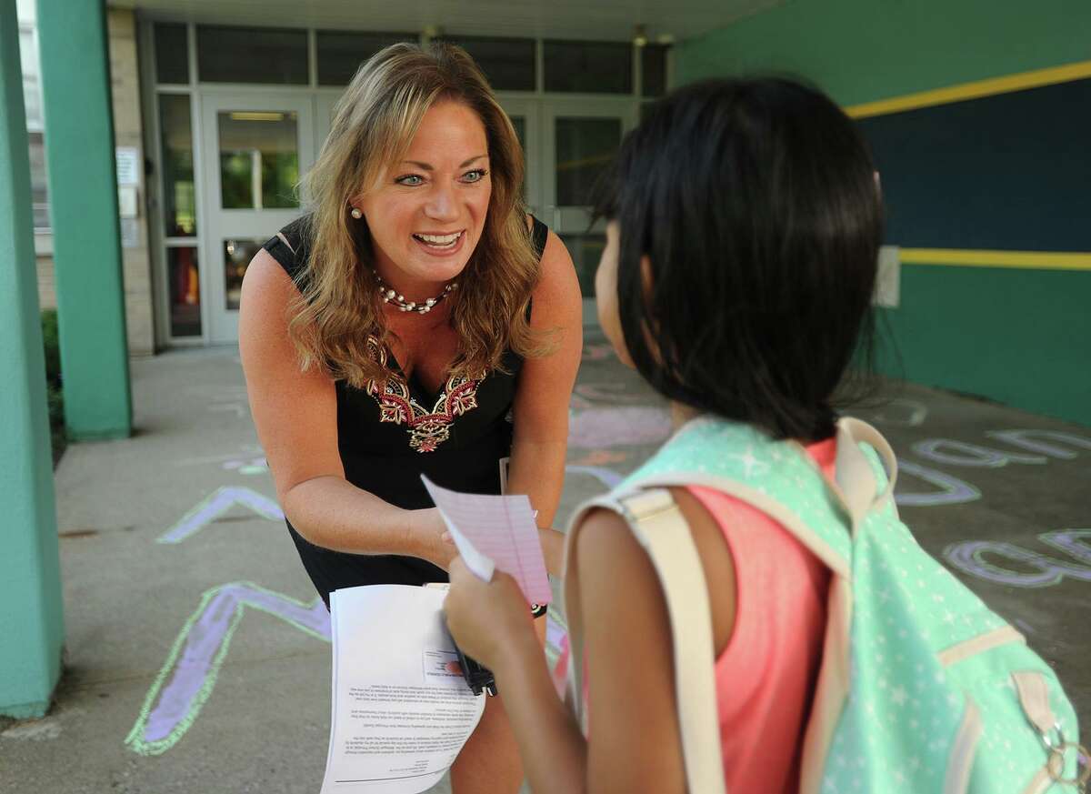 Kristen Santilli, pictured greeting students at Mohegan School in 2017, will be moving on to a new role in the district - director of curriculum, instruction and data. She was appointed to this new position by the Board of Education June 30.