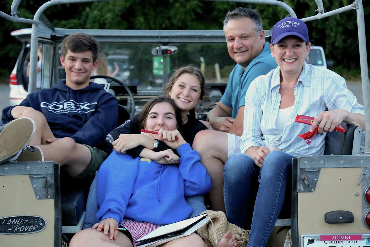 Paige Toglia of Westport, front center, joins the D'Ana family of Westport, including, from left, Oliver, Charlotte, Joe, and Alicia at the drive-in premiere of the new Remarkable Theater on Friday, June 27, 2020, in Westport, Conn.