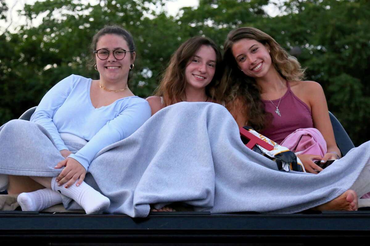 Film friends, from left, Grace Kendra and Maise Busz, both of Wilton, and Sophia Mercado of Westport at the drive-in premiere of the new Remarkable Theater on Friday, June 27, 2020, in Westport, Conn.