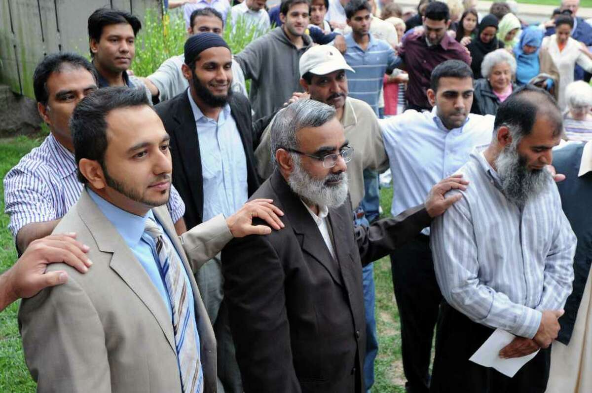 Front row from left, Midhat Syed, Zubair Quadri and Suhail Kadri pray as the InterFaith Council of Southwestern Connecticut hosts a vigil in support of the Islamic community at the First Congregational Church on Walton Place in Stamford, Conn., Tuesday, August 24, 2010. The event featured leaders from the Christian, Jewish and Muslim faiths leading prayers and discussing unity.