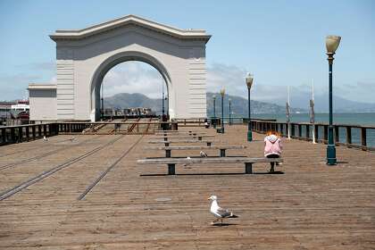 Fisherman’s Wharf is sparsely populated in San Francisco amid the pandemic.