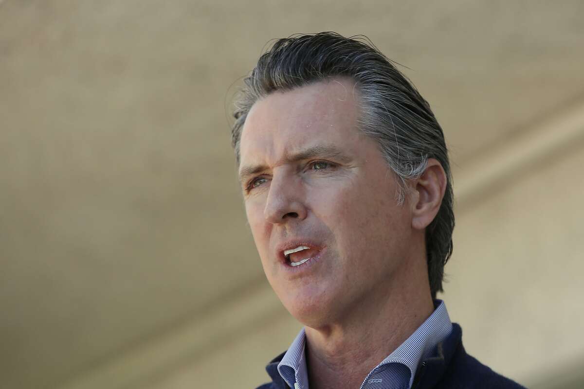 California Gov. Gavin Newsom gives an update on the state's initiative to provide housing for homeless Californians to help stem the coronavirus, during a visit to a Motel 6 participating in the program in Pittsburg, Calif., Tuesday, June 30, 2020.
