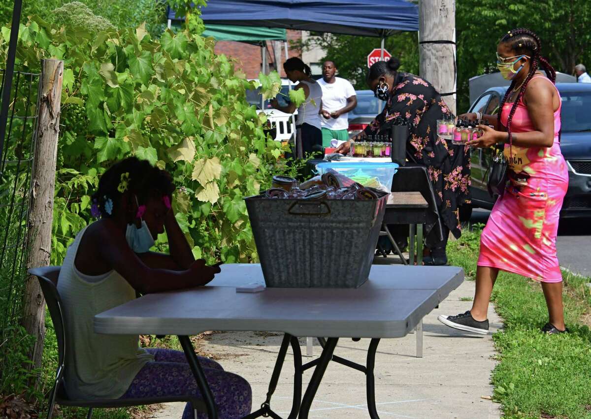 People set up their tables at the Albany South End Night Market on Thursday, July 2, 2020 in Albany, N.Y. The Albany Public Library will have a permanent pop-up location at the market starting in May 2021. (Lori Van Buren/Times Union)