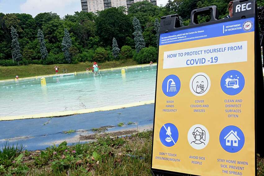 Rules to protect people from COVID-19 are posted at the Lincoln Park pool on Friday, July 3, 2020 in Albany, N.Y. The Albany pools opened today. (Lori Van Buren/Times Union)